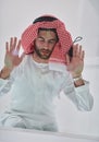 Muslim man doing sujud or sajdah on the glass floor Royalty Free Stock Photo