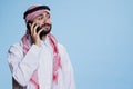 Muslim man answering smartphone call Royalty Free Stock Photo