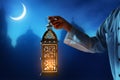 Muslim man holding arabic lantern, Ramadan kareem backgrounds Royalty Free Stock Photo