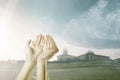 Muslim man praying with prayer beads on his hands on the sand dune Royalty Free Stock Photo