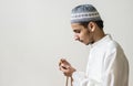 Muslim man praying with tasbih during Ramadan Royalty Free Stock Photo