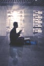 Muslim man praying to the Allah in mosque Royalty Free Stock Photo