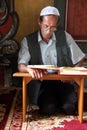 Muslim man reading the Koran in the Aladza mosque,Tetovo, Macedonia