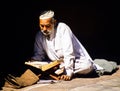 Muslim Man Reading the Koran