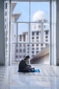 Muslim man reading the Quran at Ramadan time