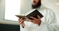 Muslim man, reciting and mosque for reading quran with faith, idea or culture for worship, praise or study. Islamic