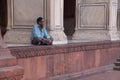 Muslim man sitting at Jama Masjid in Delhi, India Royalty Free Stock Photo