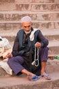 Muslim man sitting on the stairs of Jama Masjid in Delhi, India Royalty Free Stock Photo