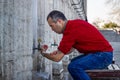 Muslim man taking ablution for prayer Royalty Free Stock Photo