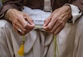 Muslim man uses his prayer beads