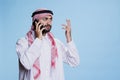 Muslim man speaking on smartphone Royalty Free Stock Photo