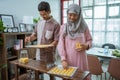 muslim man and woman bake nastar snack for idul fitri