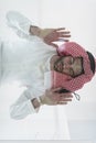 Muslim man doing sujud or sajdah on the glass floor Royalty Free Stock Photo