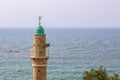 Muslim minaret tower Eastern religion architecture building moody weather Bosporus strait sea waters horizon landscape background