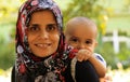 Muslim mother with child smiling