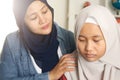 Muslim mother comforting her sad daughter, supportive mom help her girl Royalty Free Stock Photo