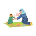 Muslim mother drink hot arabic coffee with her son Royalty Free Stock Photo