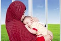 Muslim mother and her baby boy at home Royalty Free Stock Photo