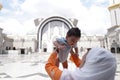 Muslim mother and her son together at a mosque Royalty Free Stock Photo