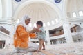 Muslim mother and her son together at a mosque Royalty Free Stock Photo