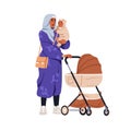 Muslim mother holding baby in arms. Arab mom in hijab with infant in hands, standing with pram, stroller during walk