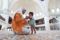 Muslim mother and her son together at a mosque Royalty Free Stock Photo