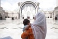 Muslim mother and her son together at a mosque Royalty Free Stock Photo