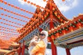 Muslim mother and her son together at a chinese temple Royalty Free Stock Photo