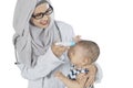 Muslim pediatrician checking her patient on studio Royalty Free Stock Photo