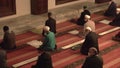 Muslim People Praying With Mosque Teacher Imam Who Reads Qur`an