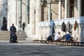 Muslim People walking out of Mosque and making traditional Ablution