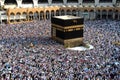 Muslim pilgrims revolving around the Kaaba in Mecca Saudi Arabia. Muslim people praying together at holy place. Royalty Free Stock Photo