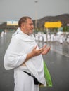 Muslim pilgrims praying on jabal Arafat, HajjHajj pilgrim prayingMuslim man wearing hajj cloth, Mecca, Saudi Arabia, August 10, Royalty Free Stock Photo