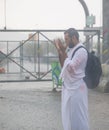 Muslim pilgrims praying on jabal Arafat, HajjHajj pilgrim prayingMuslim man wearing hajj cloth, Mecca, Saudi Arabia, August 10, Royalty Free Stock Photo