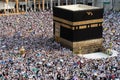 Muslim pilgrims revolving around the Kaaba in Mecca Saudi Arabia. Muslim people praying together at holy place.