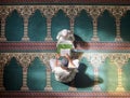 Muslim pray, child or man in praying with Quran for peace, mindfulness or support from Allah in holy mosque. Top view Royalty Free Stock Photo
