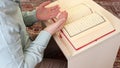 Muslim prayer in mosque with quran