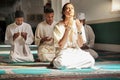 Muslim, prayer and mosque with a spiritual young man holy group praying together in religion while devoted to God. Salah