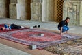 Muslim is praying in the mosque, Isfahan, Iran.