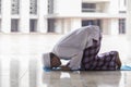 Muslim religious man doing Salat in the mosque