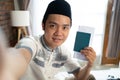 Muslim selfie men use cellphone camera when hold passports