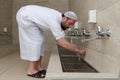 A Muslim takes ablution for prayer. Islamic religious rite