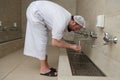 A Muslim takes ablution for prayer. Islamic religious rite