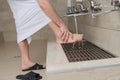 A Muslim takes ablution for prayer. Islamic religious rite