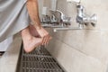 A Muslim takes ablution for prayer. Islamic religious rite