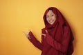 Muslim Teenage Girl Smiling and  Pointing to The Side With Copy Space Royalty Free Stock Photo