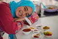 Muslim traditional woman working in kitchen