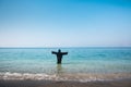 Muslim woman in abaya by the seaside