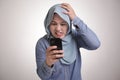 Muslim Woman Angry While Reading Text Message on Smart Phone Royalty Free Stock Photo