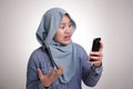 Muslim Woman Angry While Reading Text Message on Smart Phone Royalty Free Stock Photo